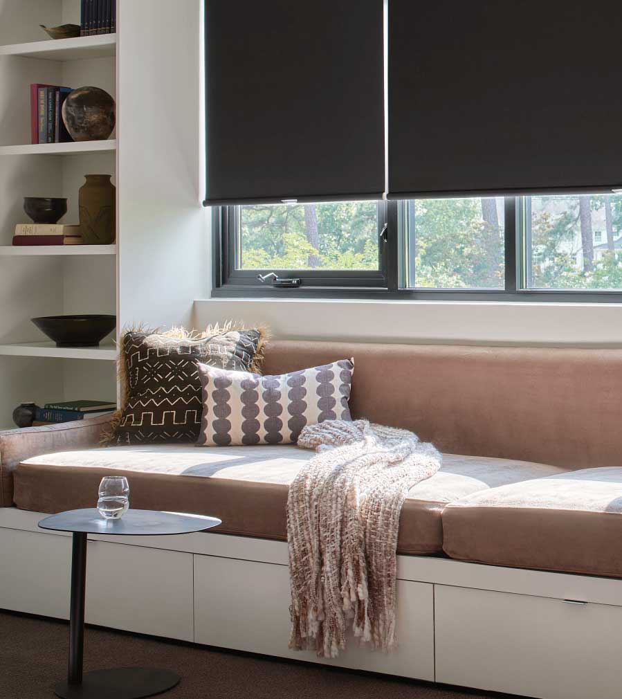 black window shades with reading nook