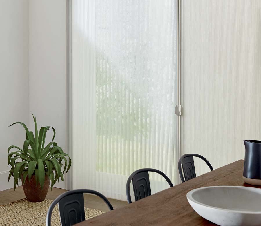 vertical cellular shades on sliding door for energy efficiency