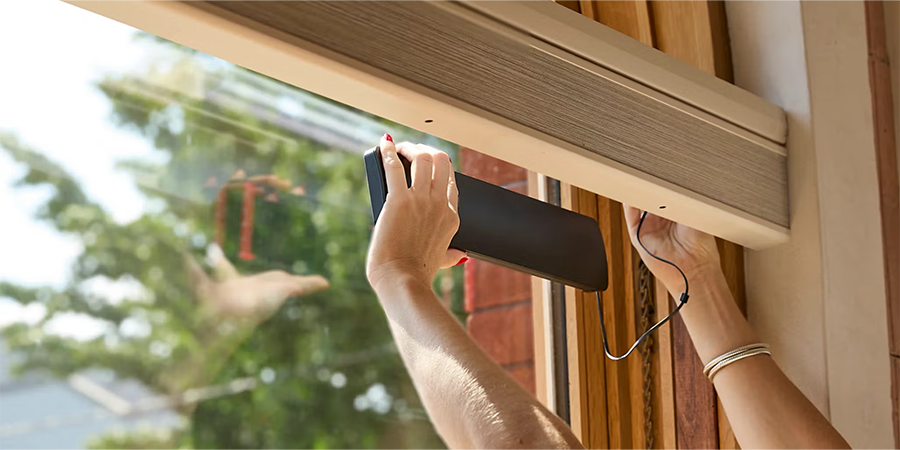 PowerView® solar charger being installed by attaching to the window
